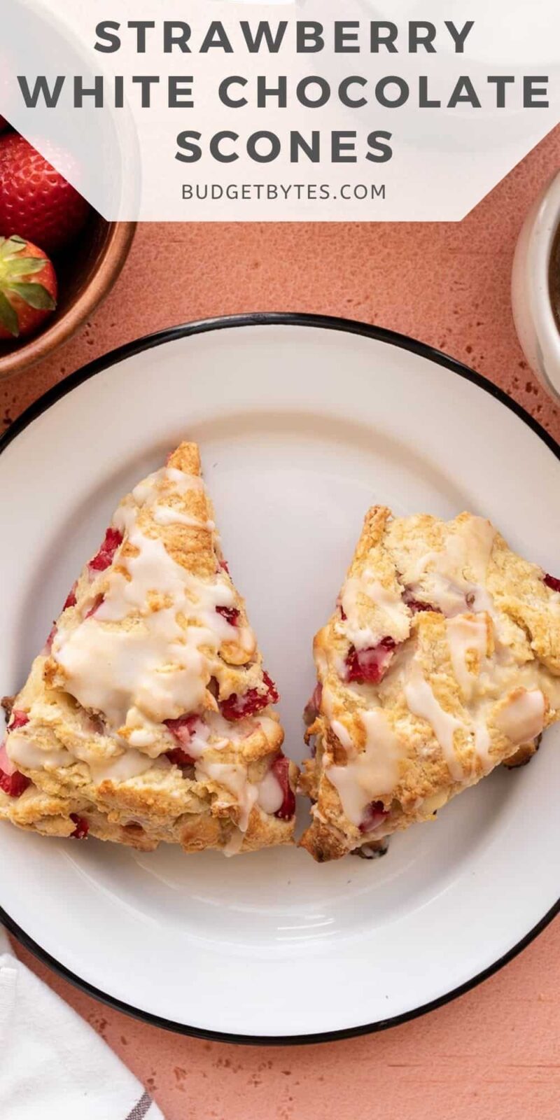 Two strawberry scones on a plate, title text at the top
