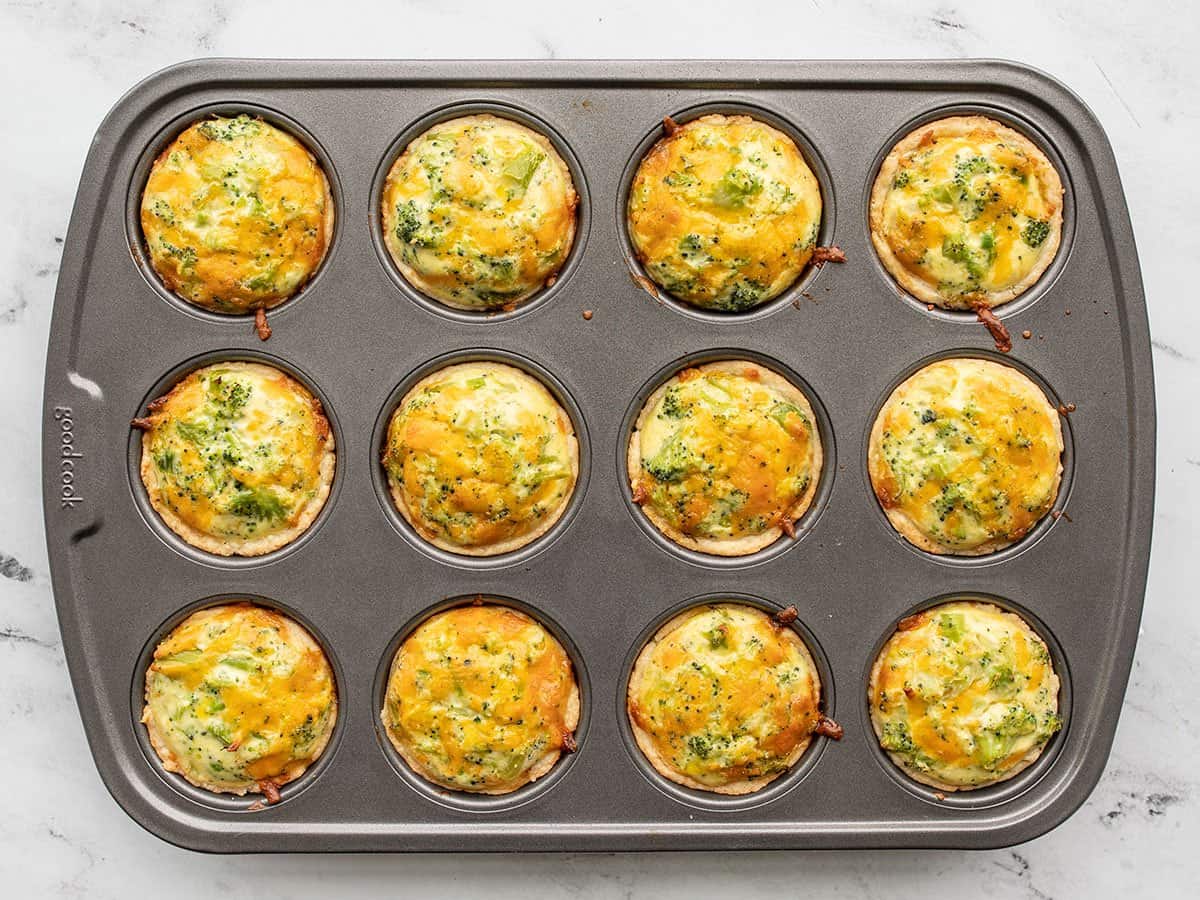 Baked broccoli cheddar quiches in the muffin tin.