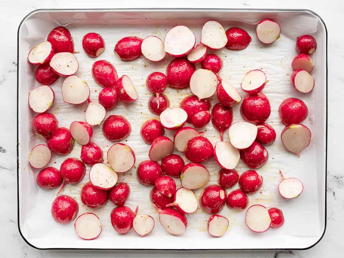 seasoned radishes on the baking sheet.