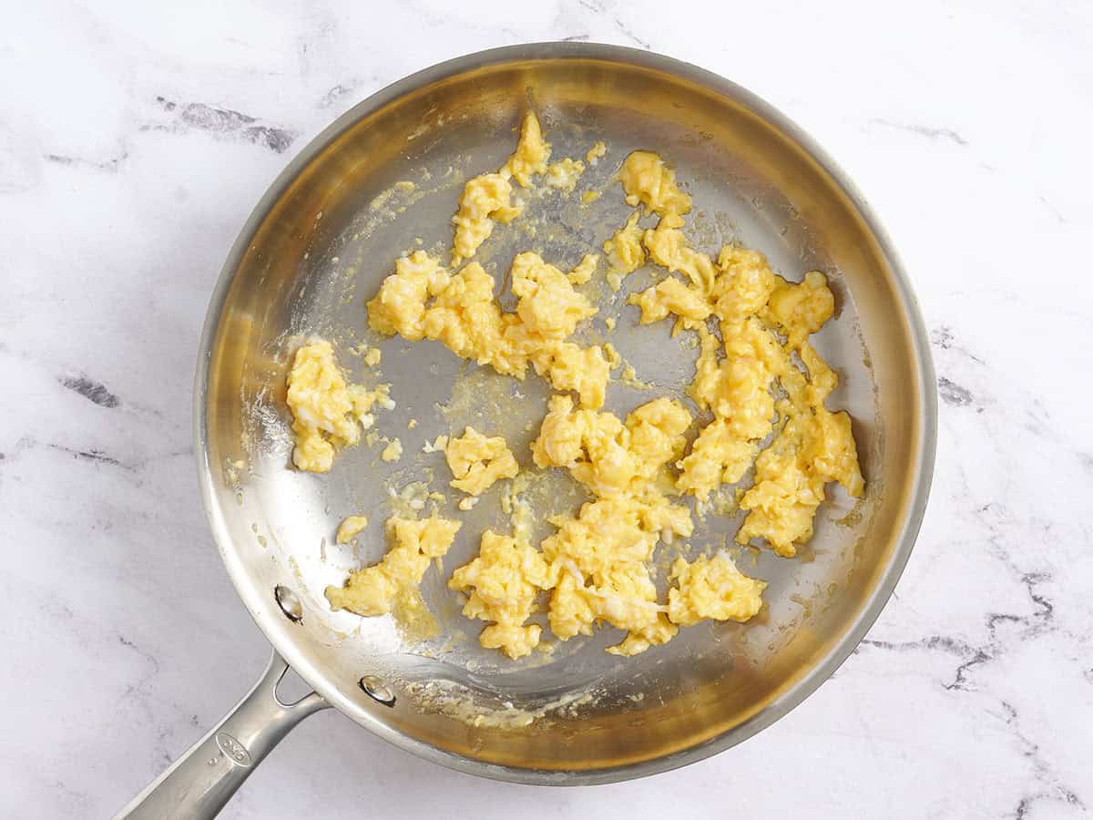 Scrambled eggs in a skillet.