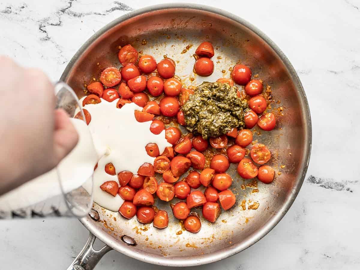 Pesto and cream added to the skillet with the tomatoes.