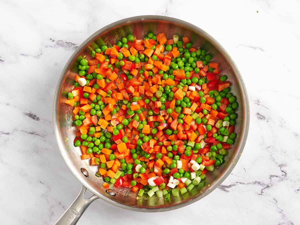 Diced veggies in a skillet.