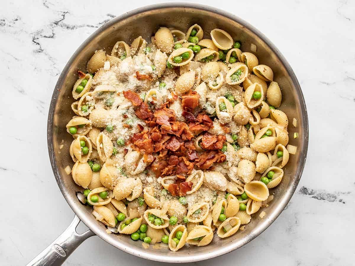 Parmesan and bacon added to the skillet.