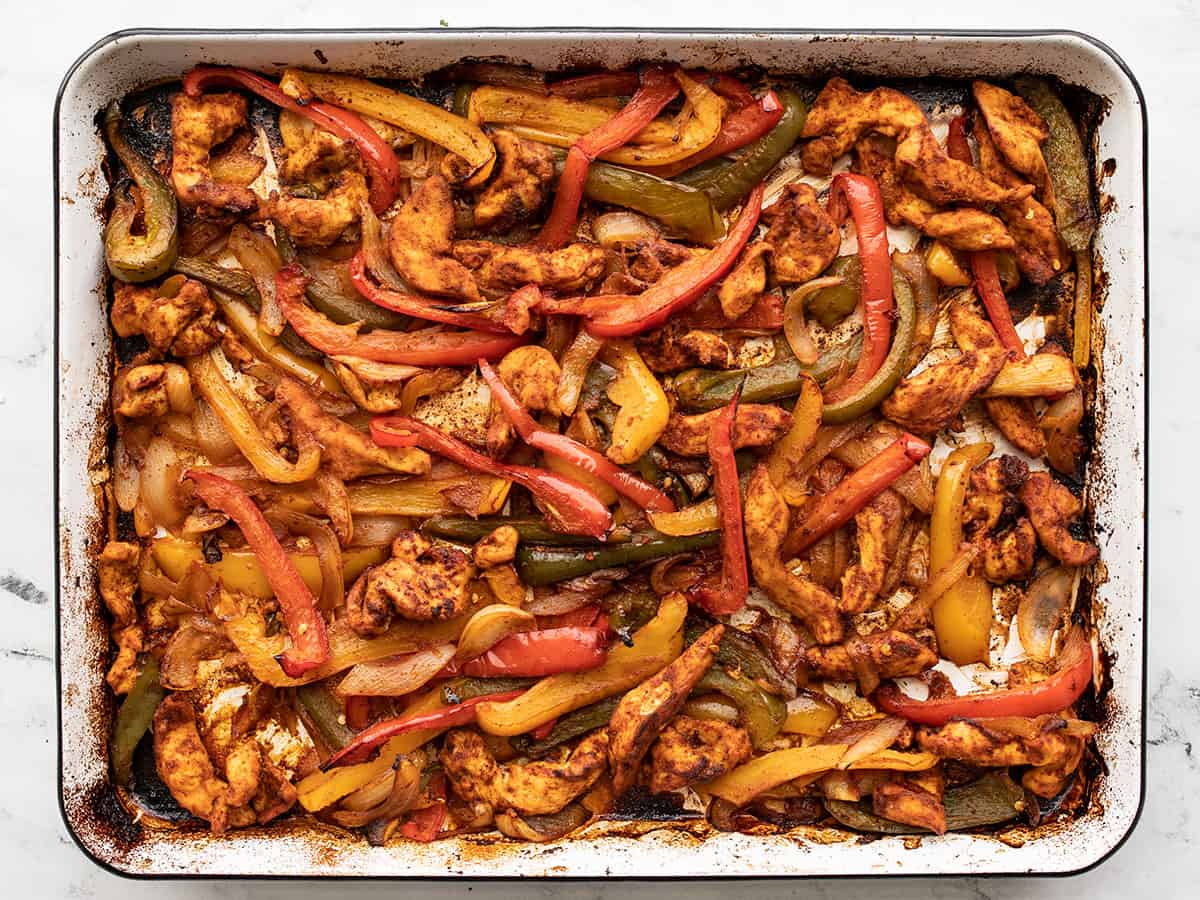 Baked chicken fajitas on the sheet pan.