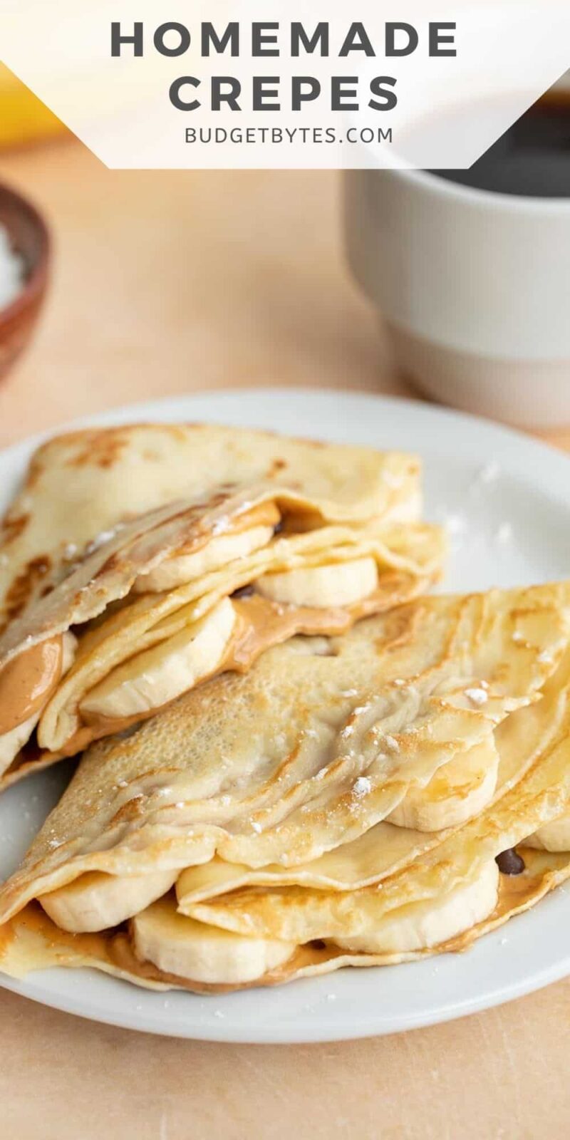 Two filled and folded crepes on a plate