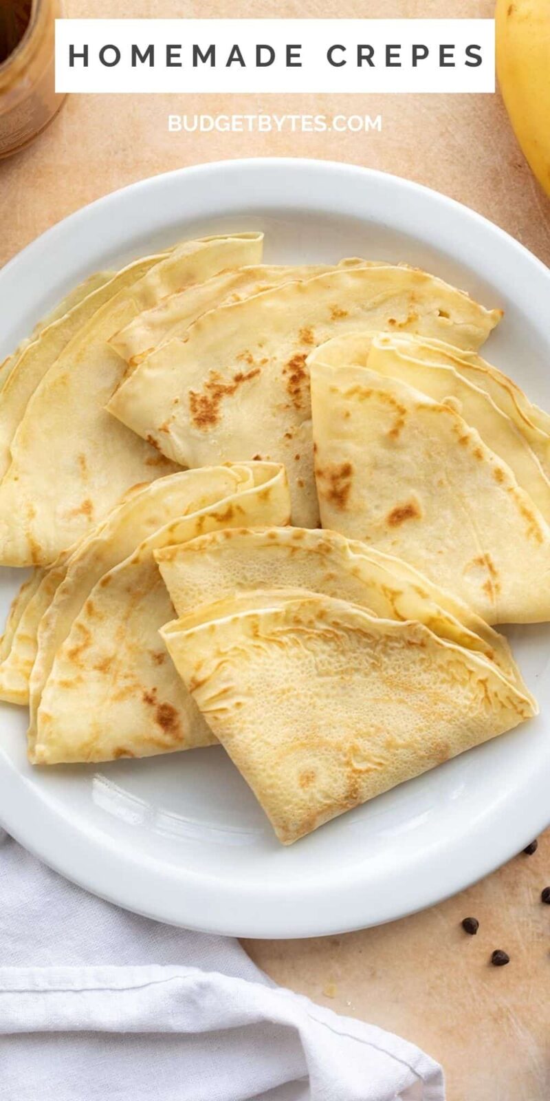 Several folded crepes on a plate.