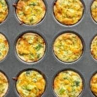 mini broccoli cheddar quiches in a muffin tin.