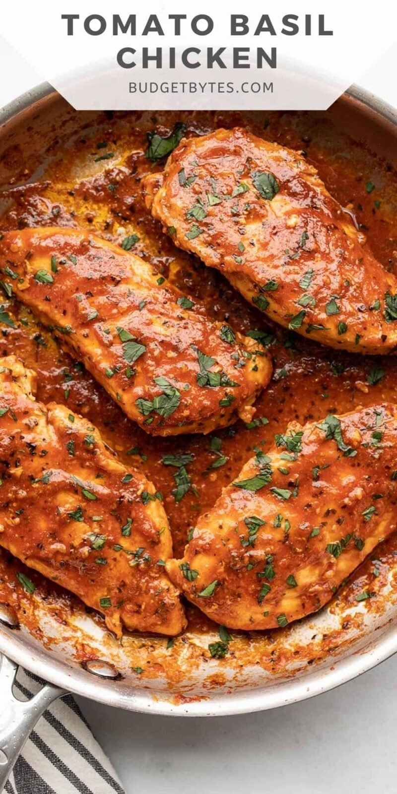 close up of tomato basil chicken in the skillet, title text at the top.