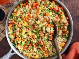 Overhead view of vegetable fried rice in a skillet.