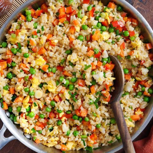 Overhead view of vegetable fried rice in a skillet.