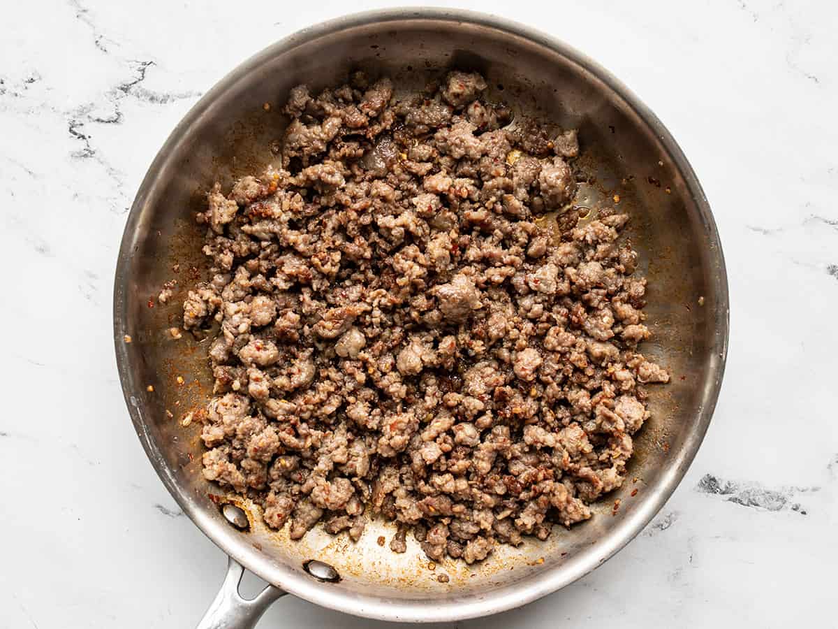 Browned sausage in a skillet.