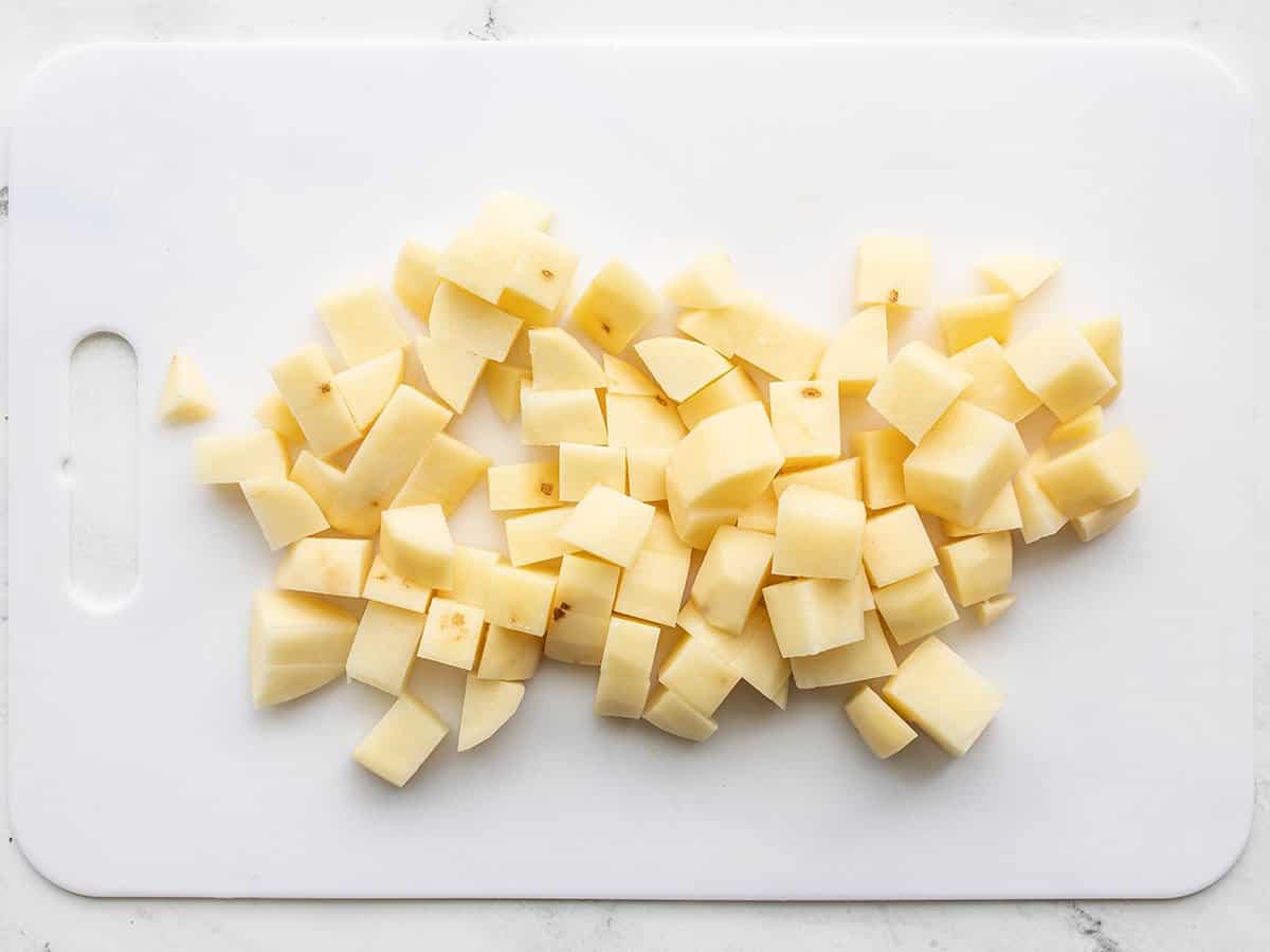 Diced potatoes on a cutting board.