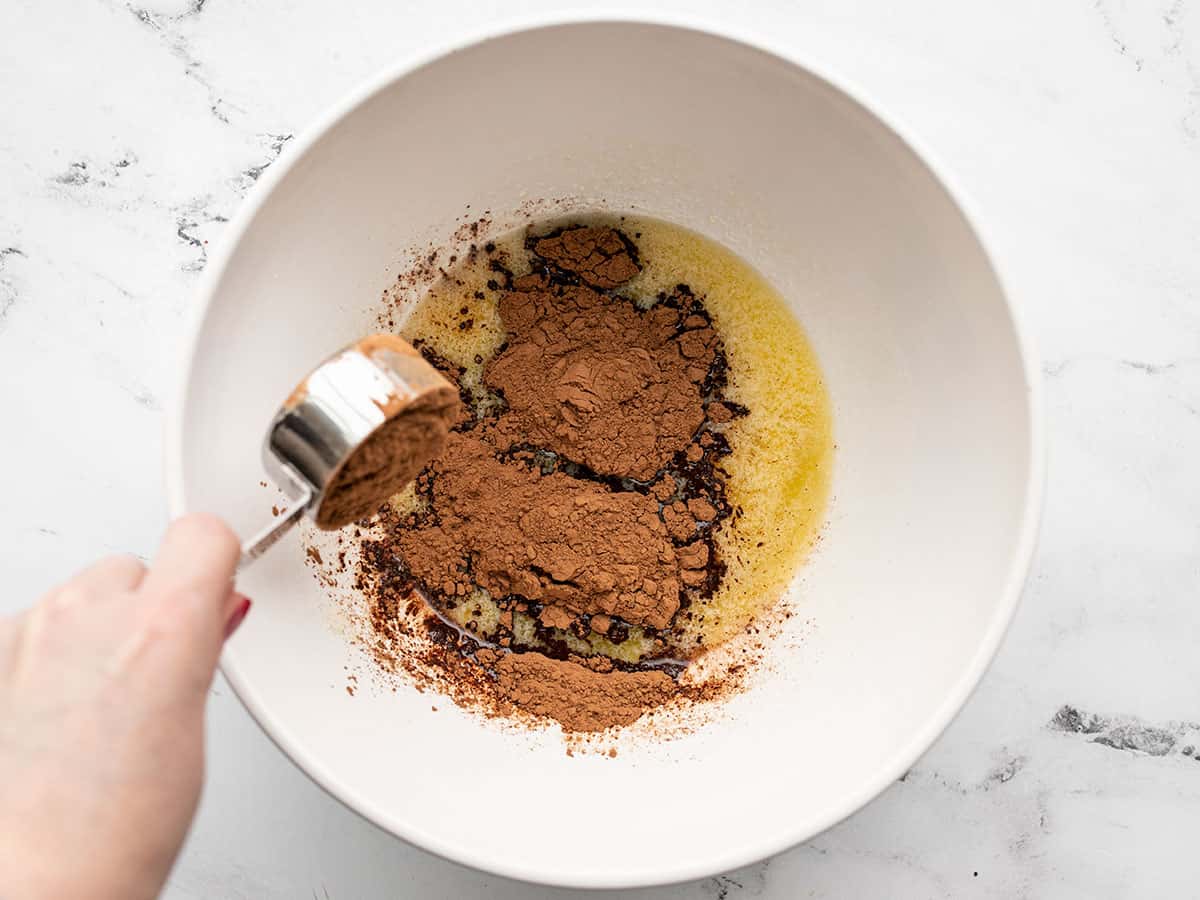 Cocoa powder added to melted butter.