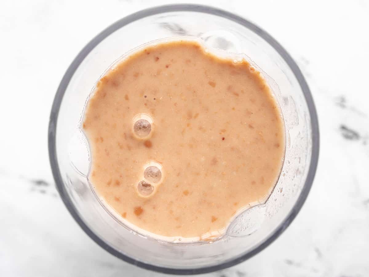 Puréed pinto beans in a blender.