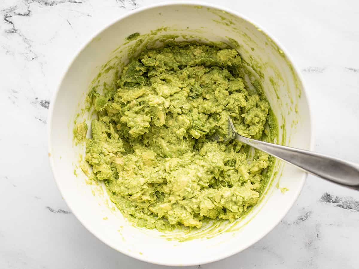 Mashed avocado in a bowl.