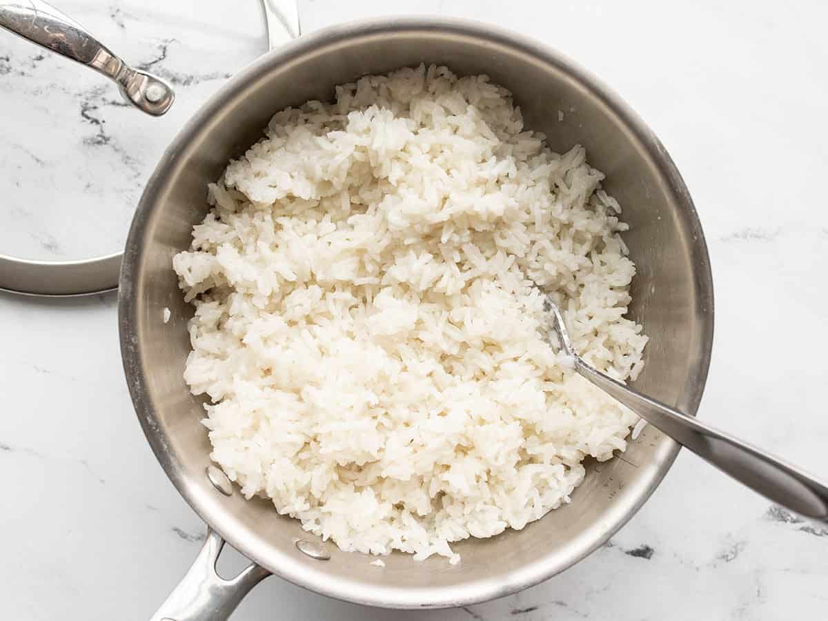 The rice is softened in a saucepan.