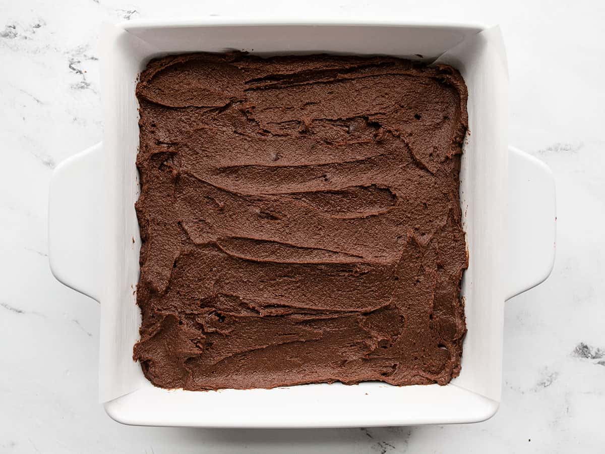 Brownie batter in the prepared baking dish.