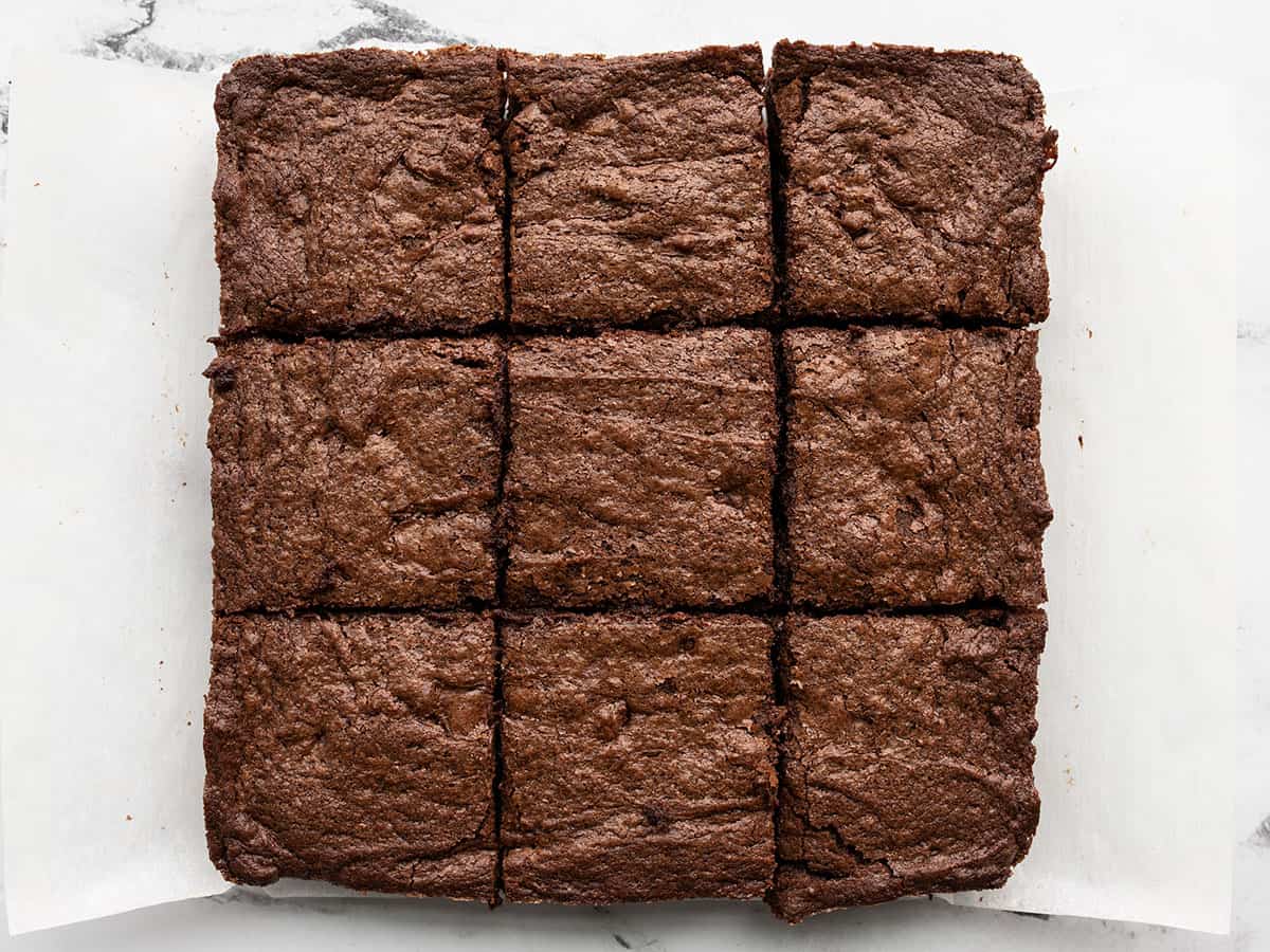 sliced brownies on a piece of parchment paper.