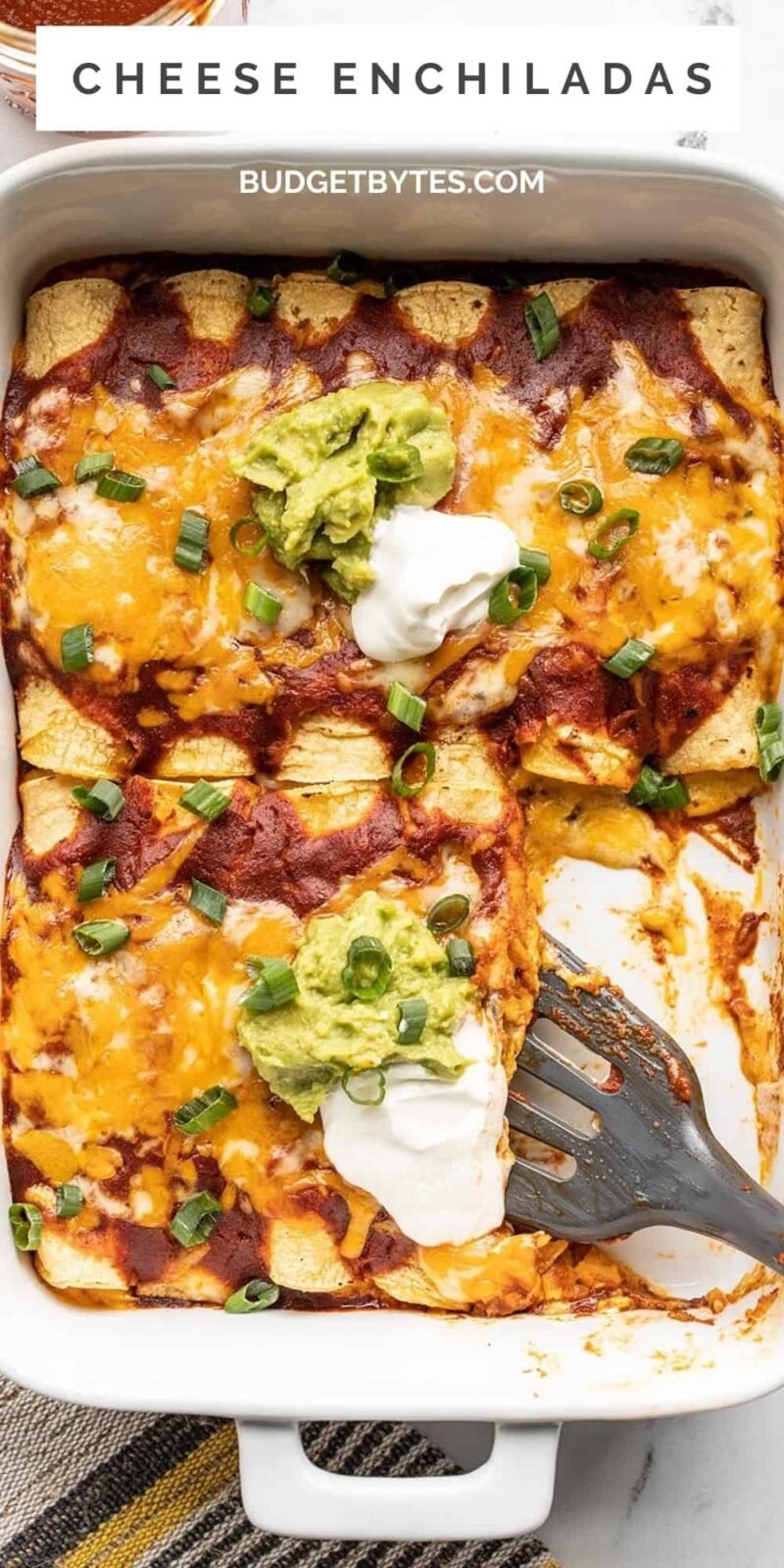 Overhead view of a casserole dish full of cheese enchiladas