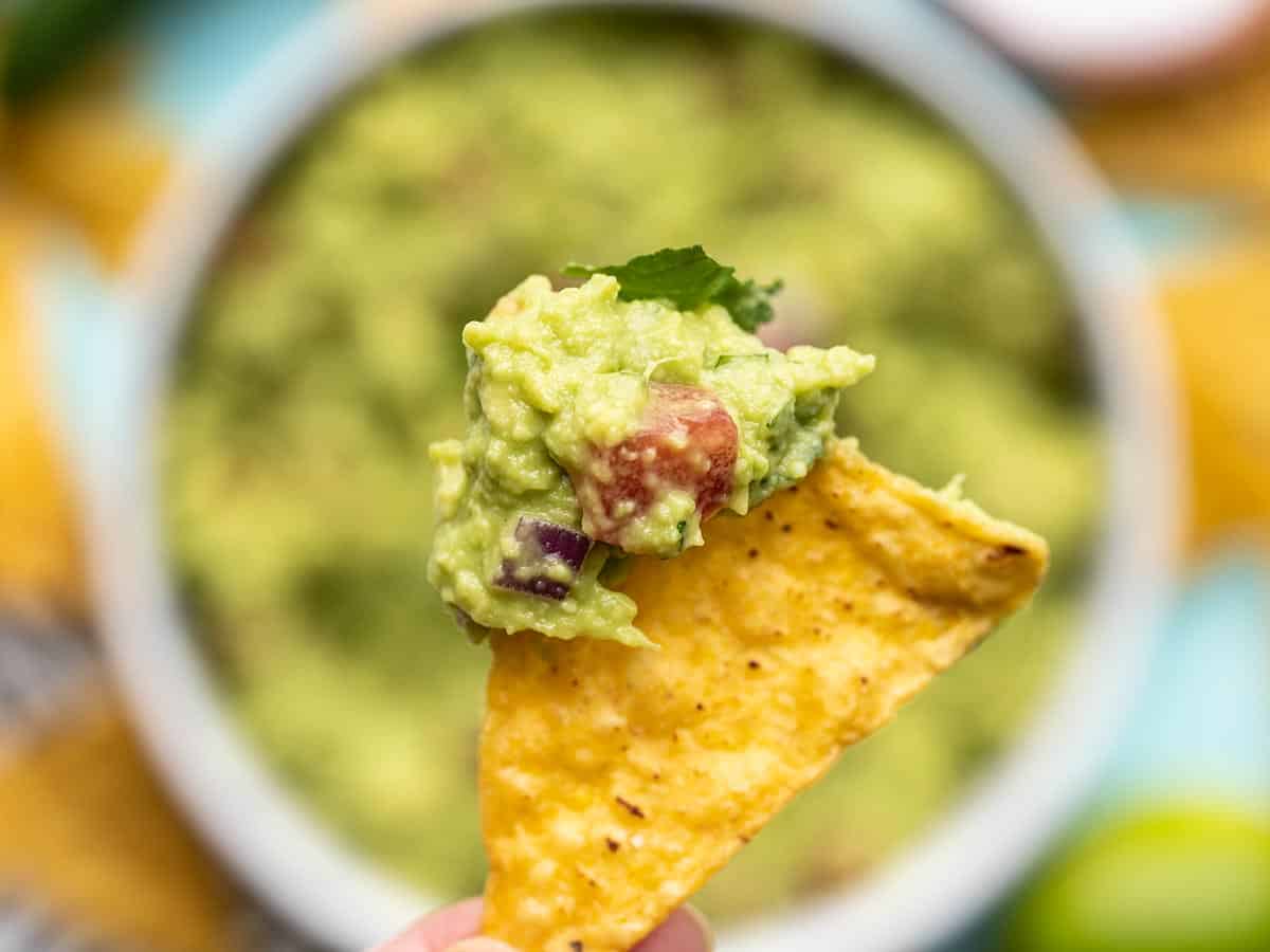 Close up of guacamole on a chip.