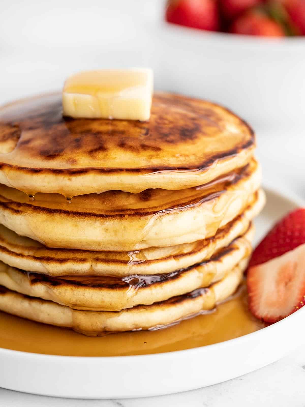Close up side view of a stack of pancakes