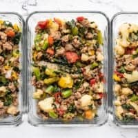 Sausage and Vegetables in glass meal prep containers.