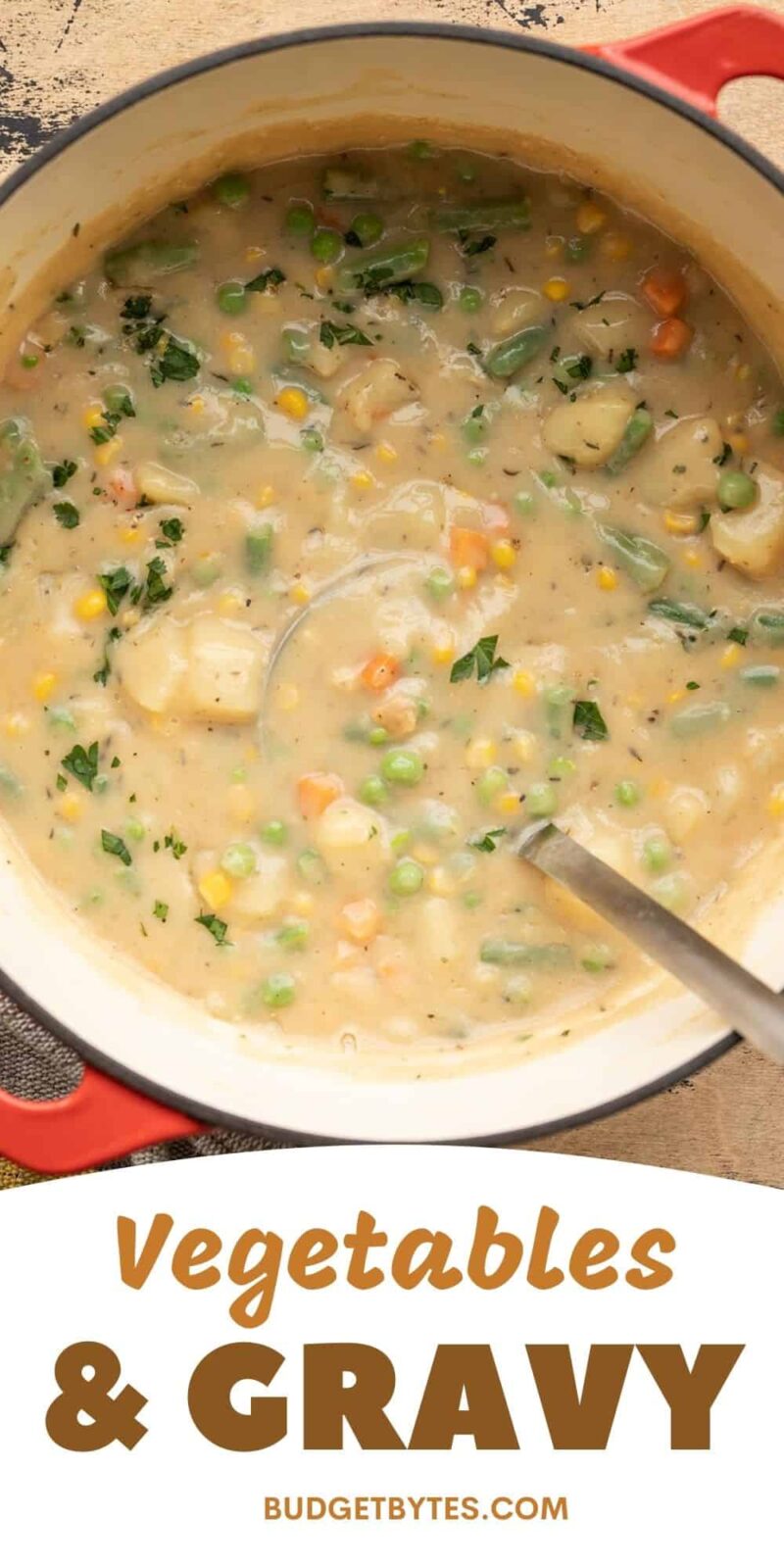 Overhead view of a pot full of vegetables and gravy.