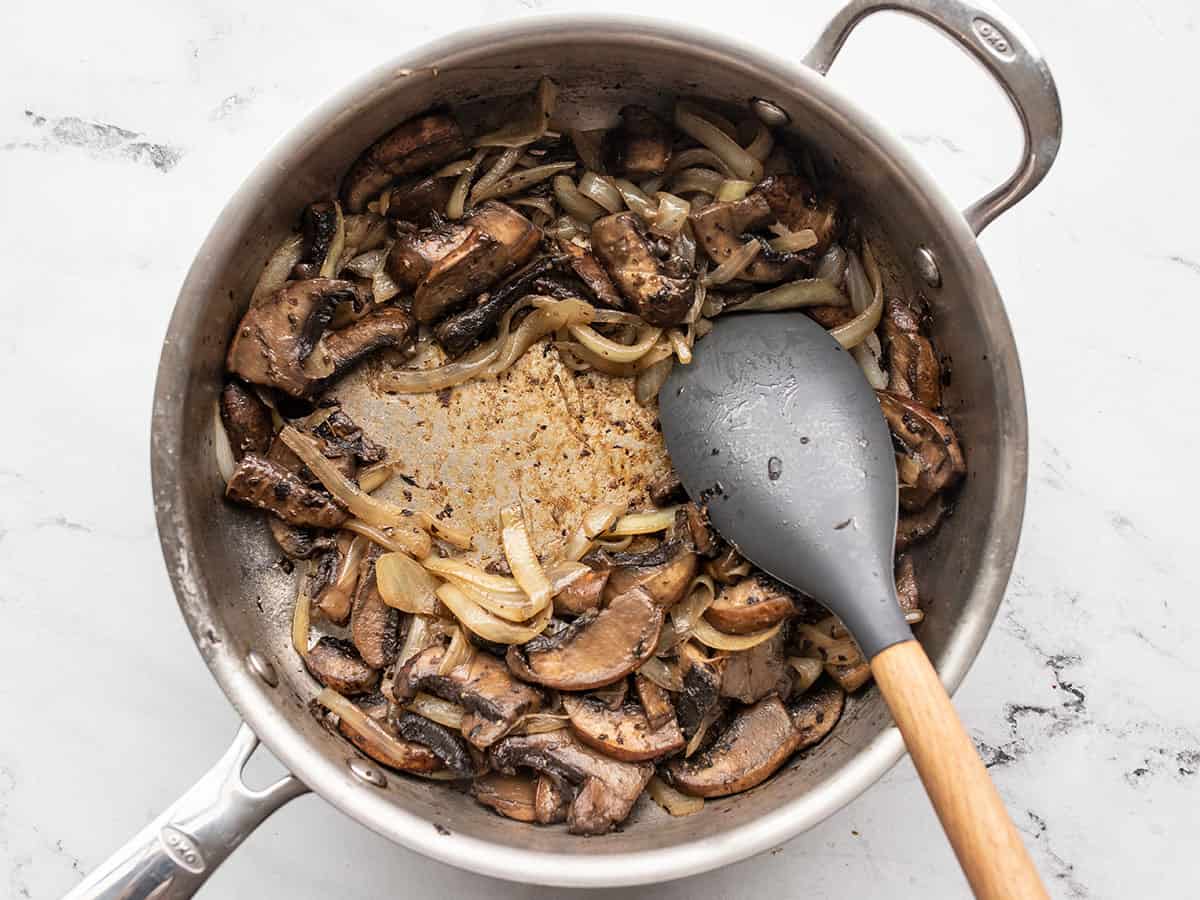 Sautéed mushrooms in the skillet.