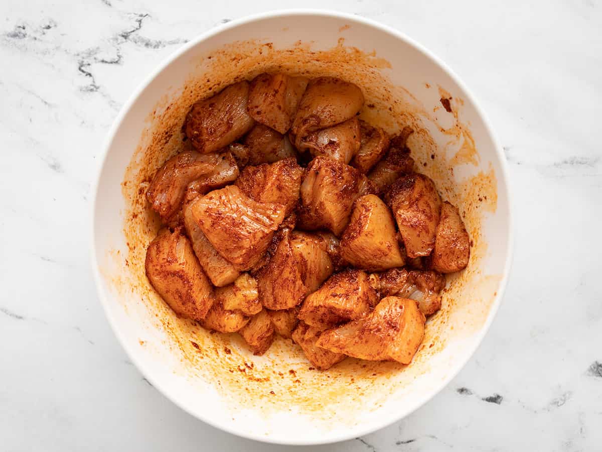 Seasoned chicken in a bowl.
