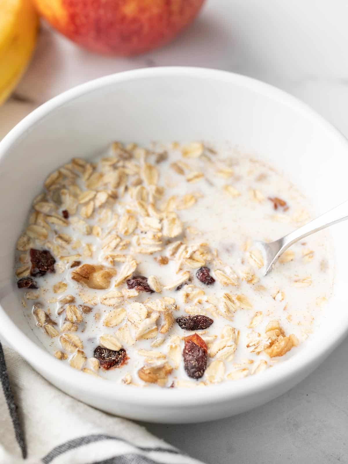 Close up side view of a bowl of muesli.