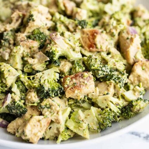 Close up side view of Pesto Chicken and Broccoli Salad in a bowl.