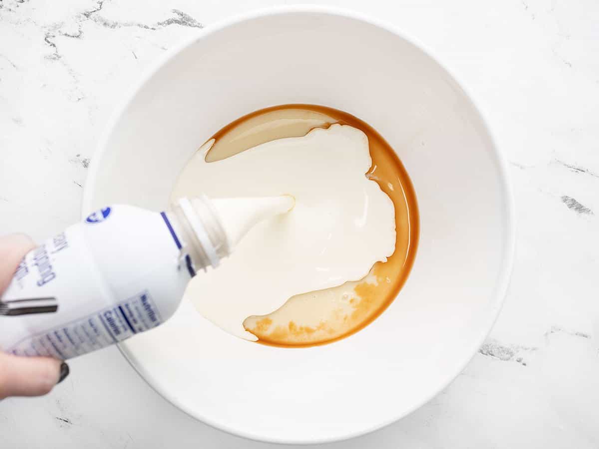 Combine heavy cream, condensed milk, vanilla, and salt in a bowl.