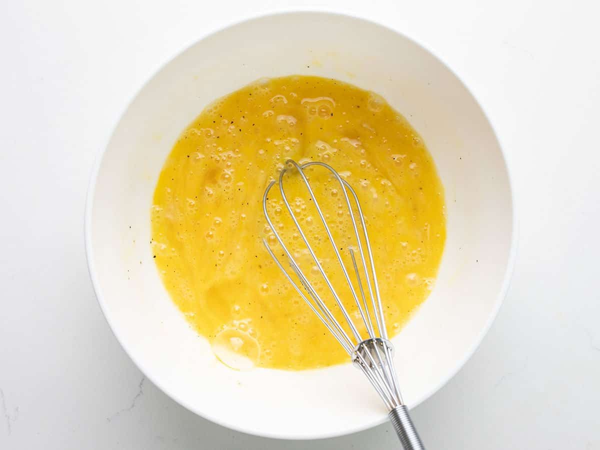 Whisked eggs in a bowl.