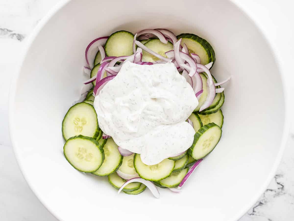 Combine cucumber, onion, and dressing.