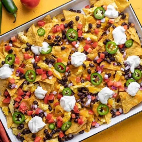 Overhead view of breakfast nachos on the sheet pan.