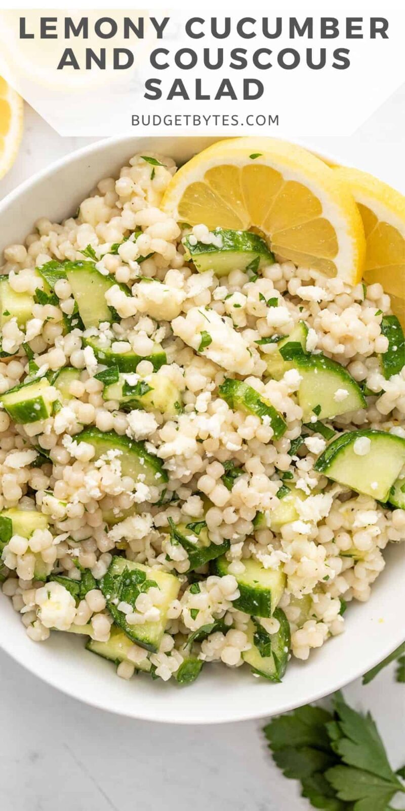 Close up overhead view of a bowl of lemony cucumber couscous salad.