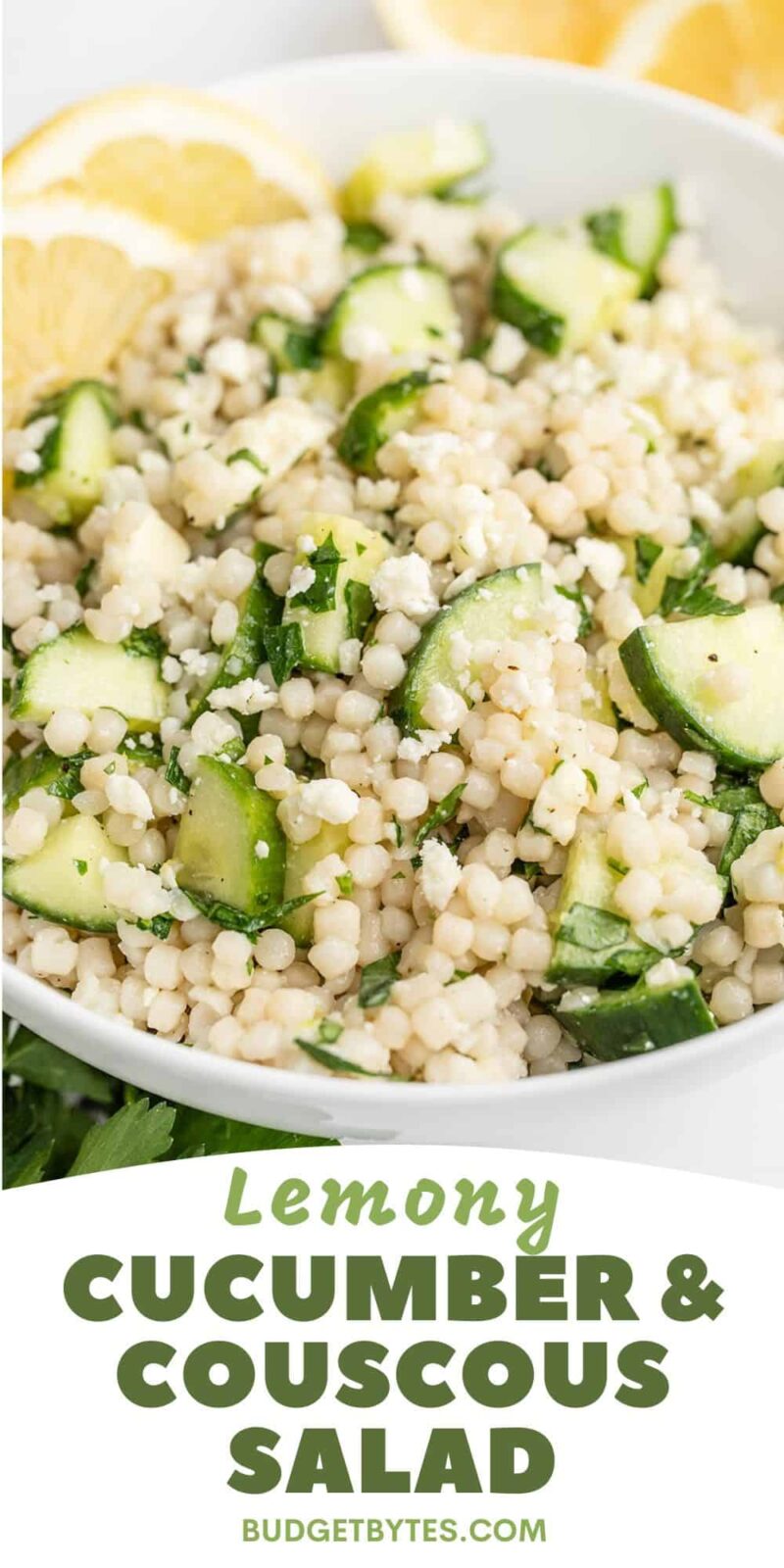 Close up side view of a bowl of lemony cucumber couscous salad.