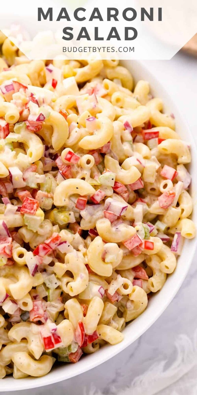 Close up overhead view of macaroni salad in a bowl.