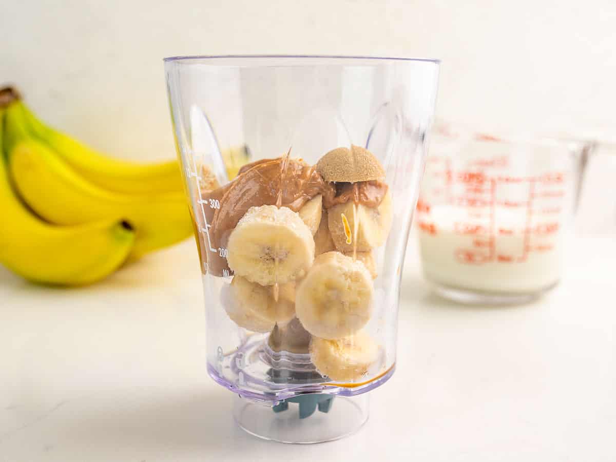 Smoothie ingredients in a blender cup.