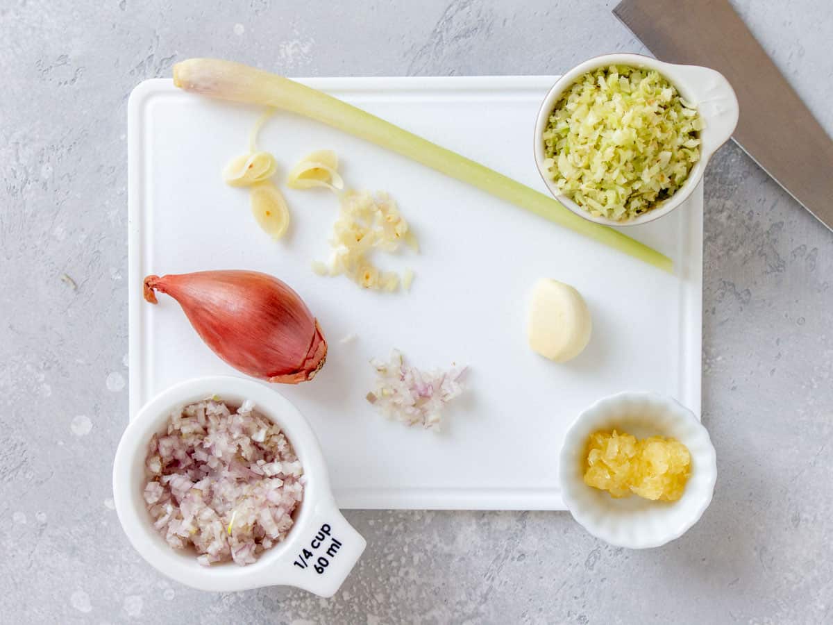 Prepared aromatics for the meatballs on a cutting board.