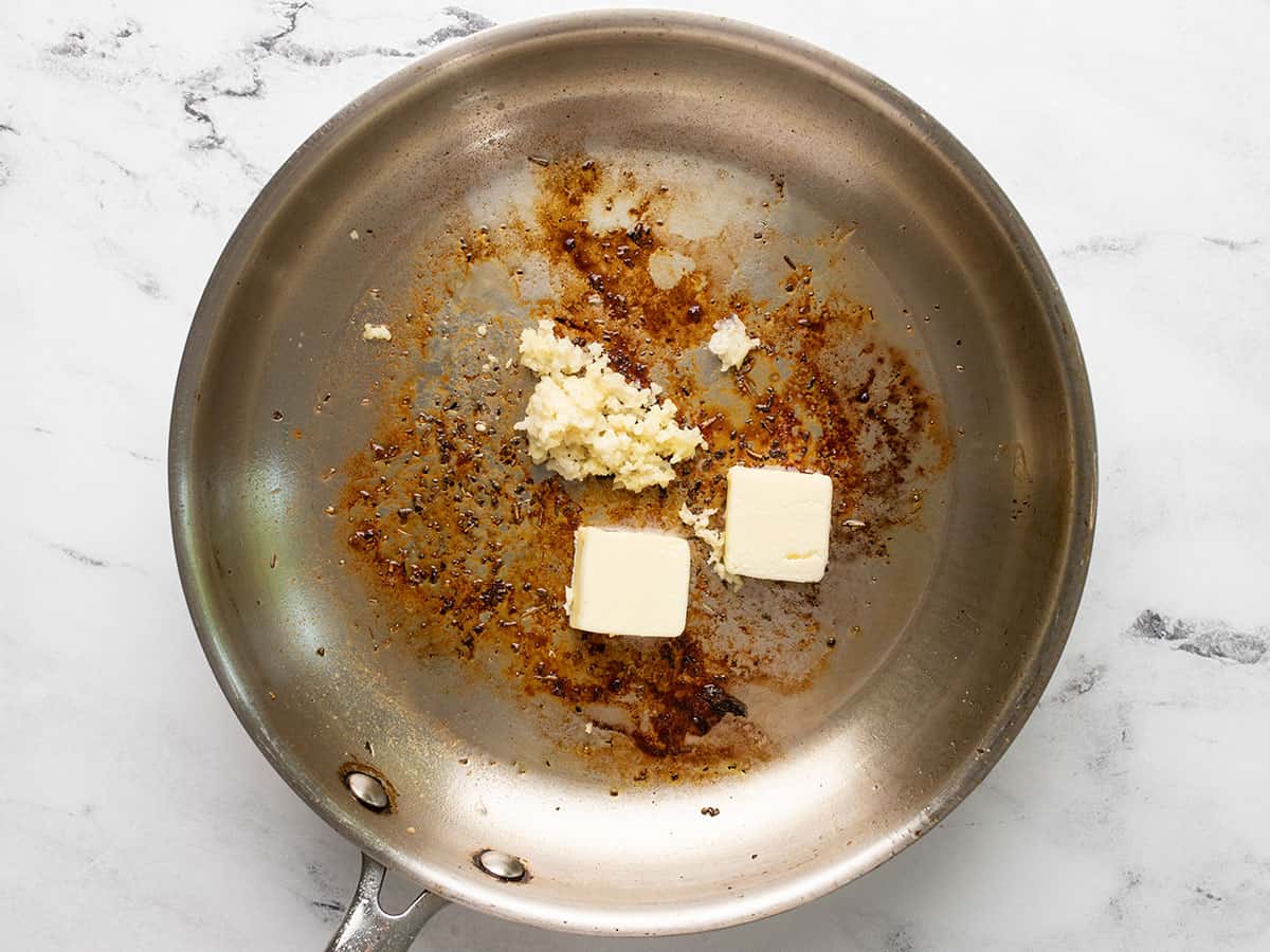 Butter and minced garlic in the skillet.