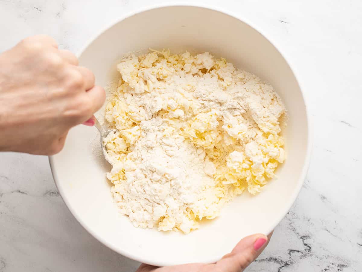 Overhead shot of flour and butter mixture being tossed with a fork.