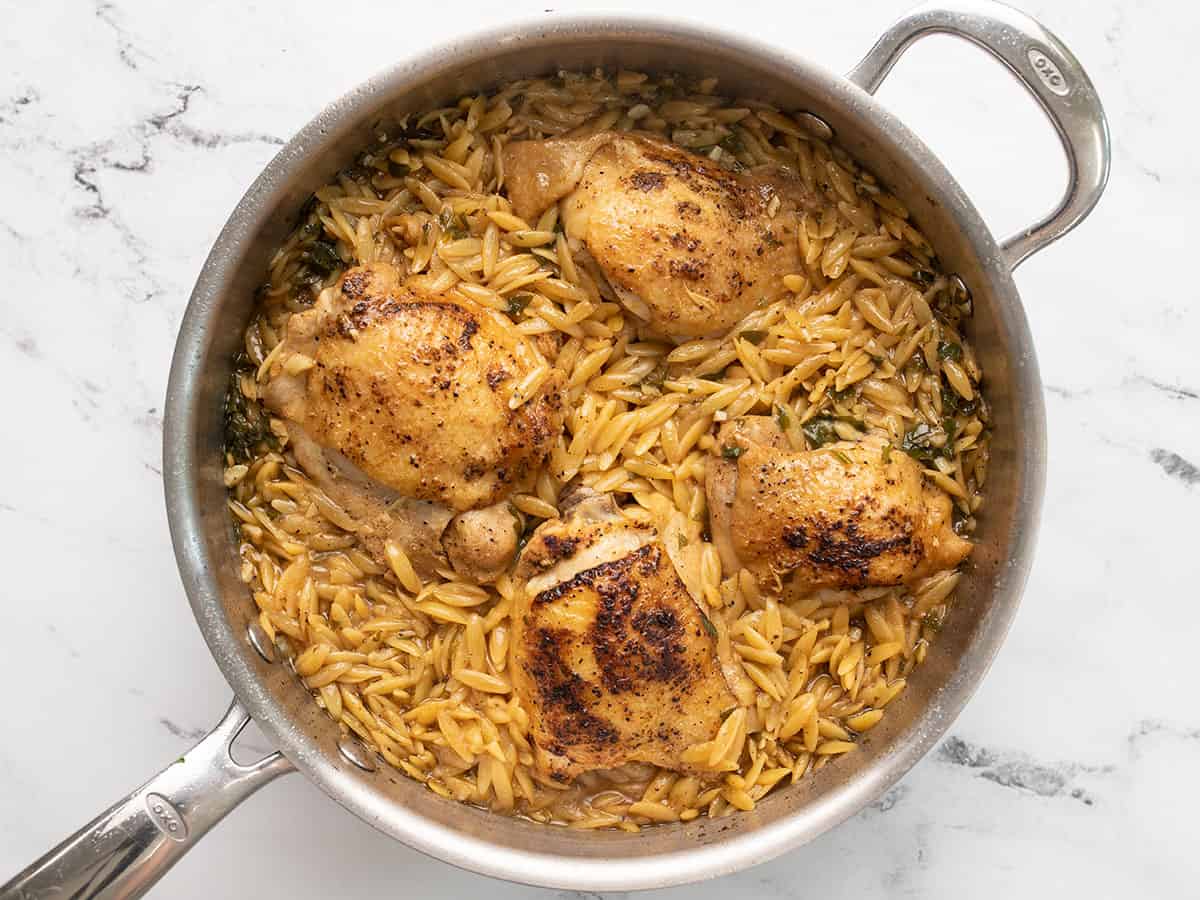 Cooked orzo and chicken in the pot.