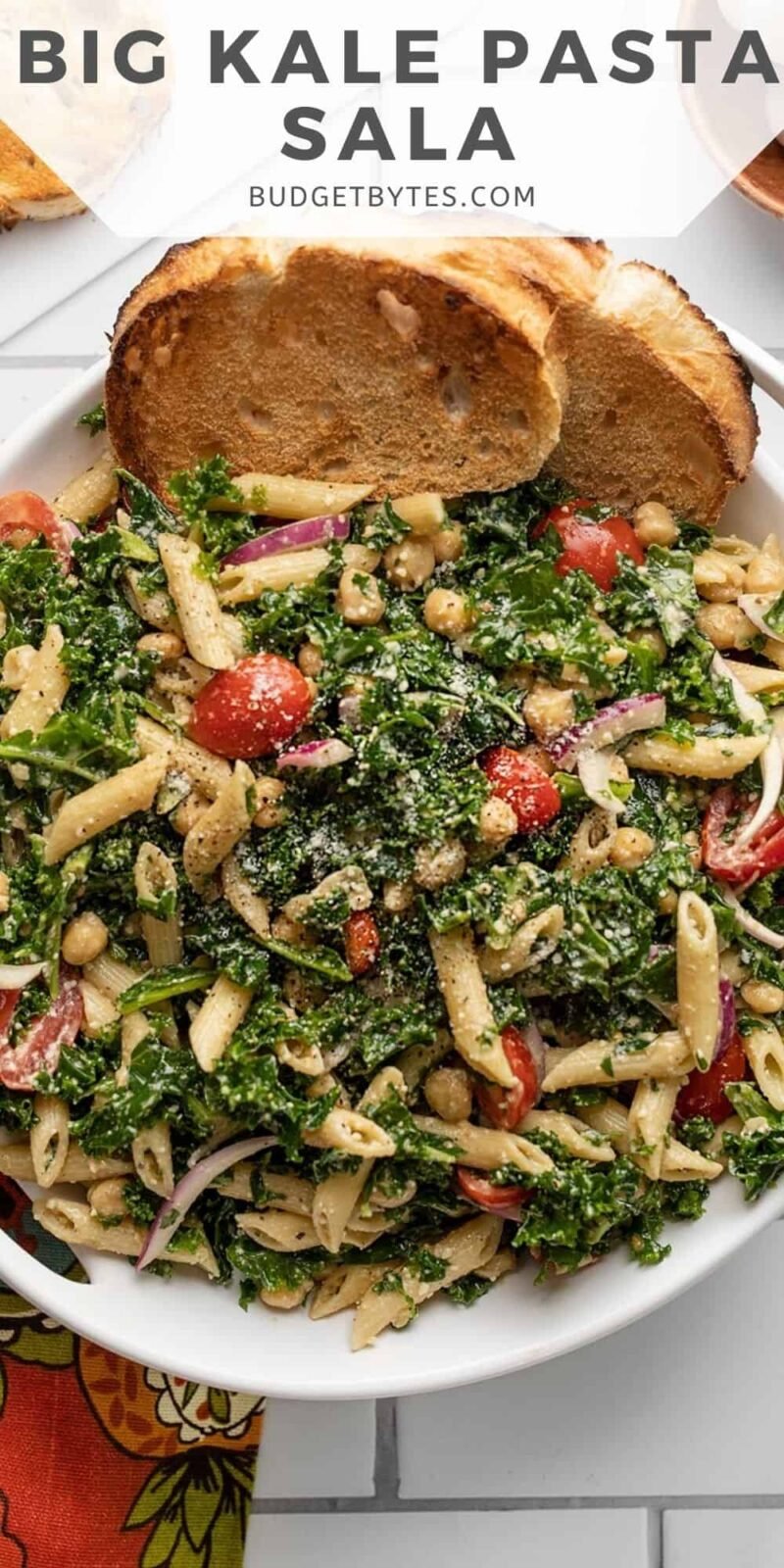 Overhead view of a serving bowl full of kale pasta salad