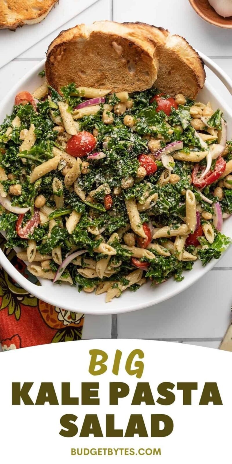 Overhead of a serving bowl full of kale pasta salad.