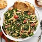 Overhead view of the serving bowl full of kale pasta salad.