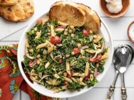 Overhead view of the serving bowl full of kale pasta salad.