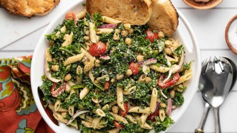 Overhead view of the serving bowl full of kale pasta salad.