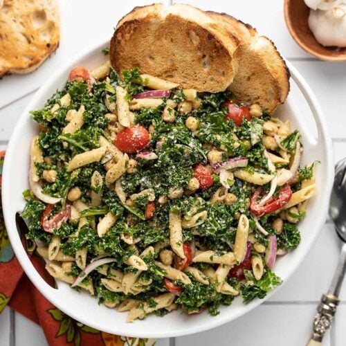 Overhead view of the serving bowl full of kale pasta salad.