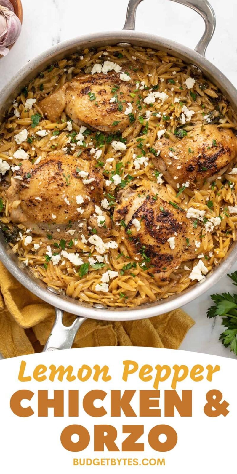 Overhead view of a skillet full of lemon pepper chicken and orzo.